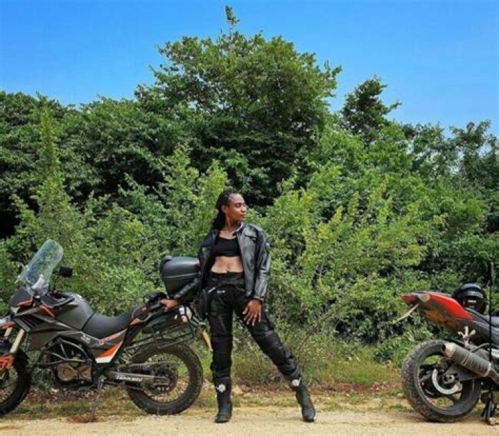 Obafemi Martins Takes Beautiful Wife on Motorbike Cruise Around Local Nigerian Community